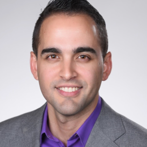 Headshot of Dr. Oscar Merino smiling.