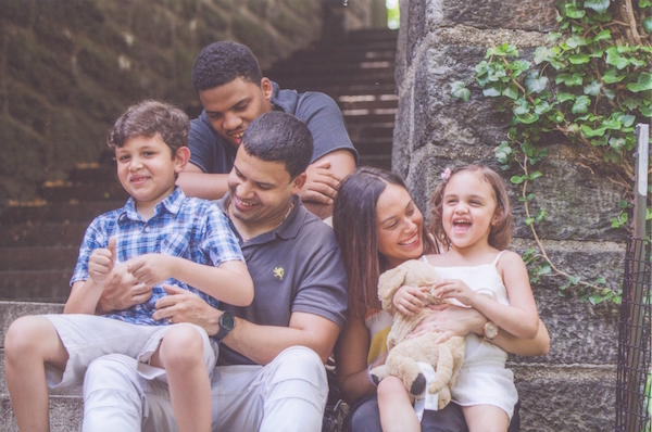 Sybil Goday-Pena, pictured above with her family, enrolled in TCOP after the financial crash in 2008.