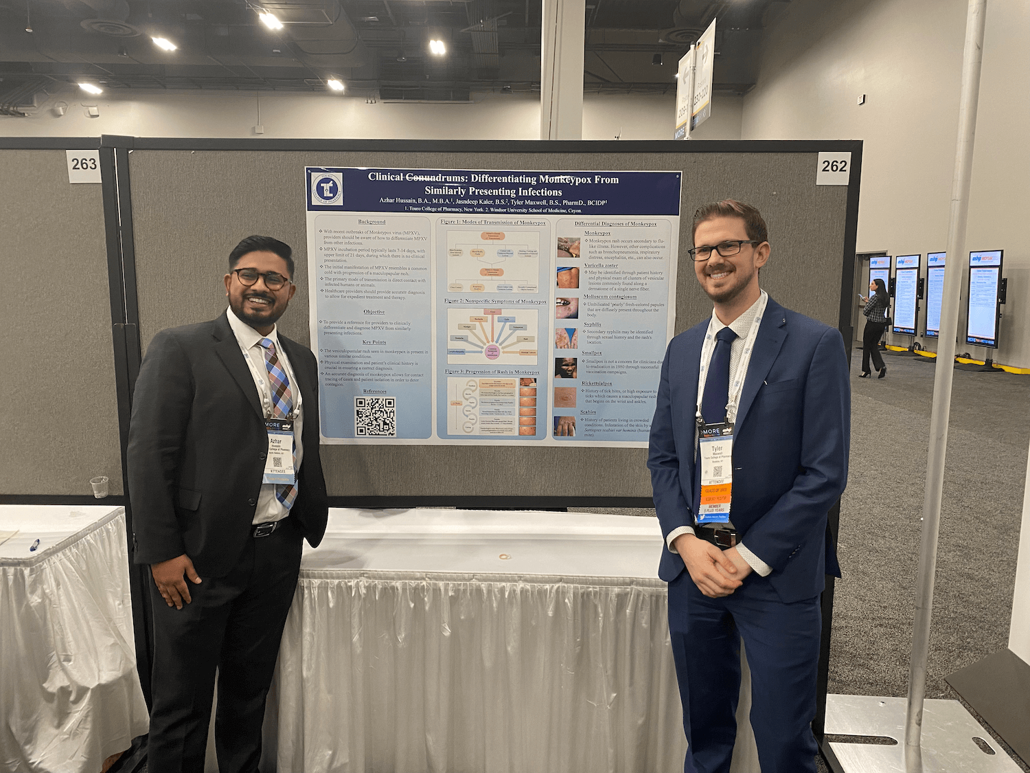 Azhar Hussain and Dr. Tyler Maxwell stand before their poster presentation at Midyear 2022.