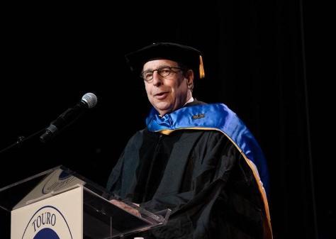 man speaking at podium