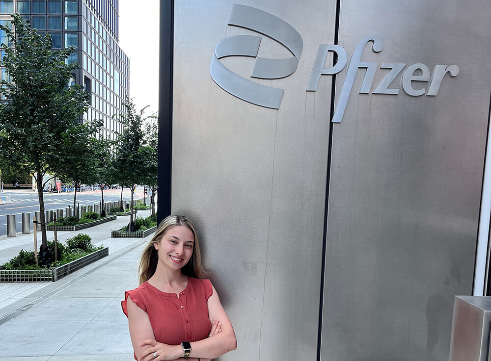 Nino Barayev standing outside the Pfizer building in NYC