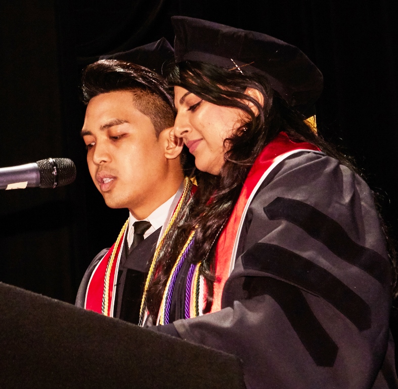 Student Body President Philip Armendi and Class Valedictorian Mehwish Mahmood speaking jointly to their class at commencement.